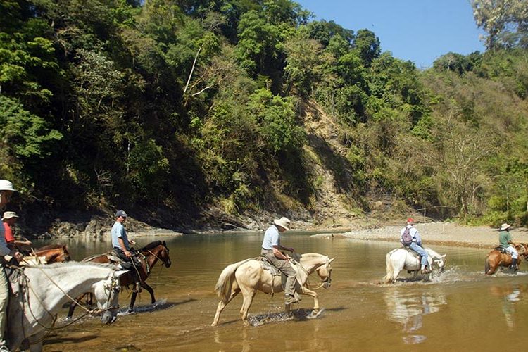 Crossing Rafiki's swim hole, Savegre River