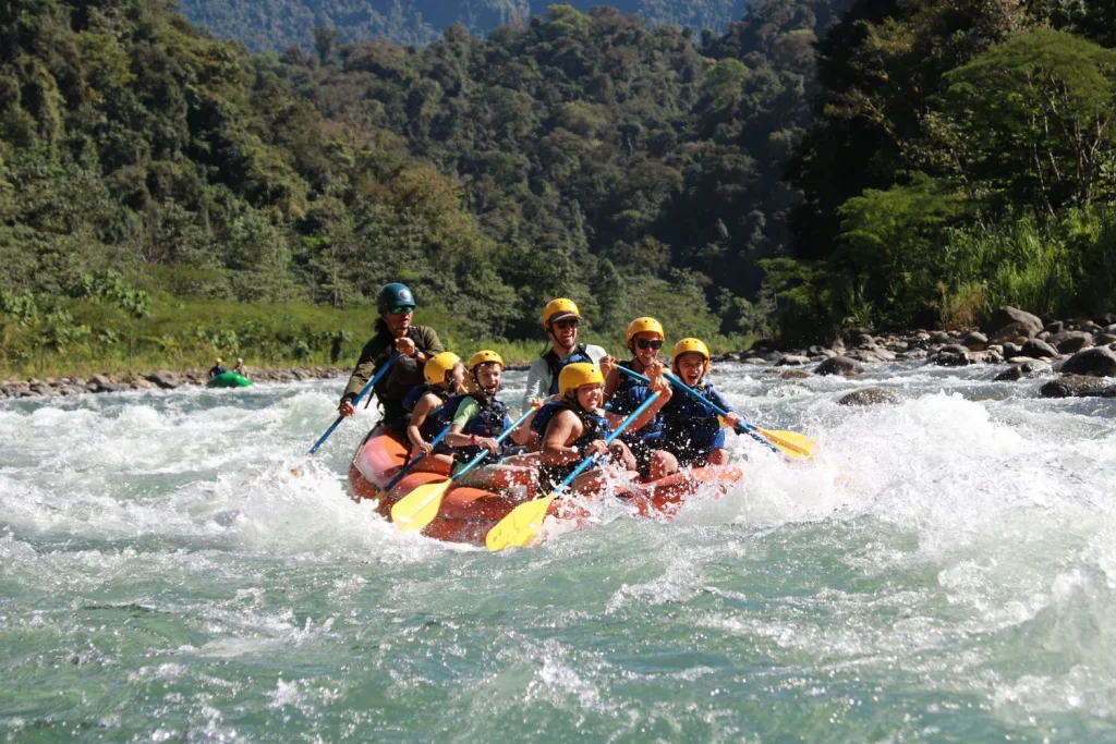 Family rafting through the rapids of the Savegre River