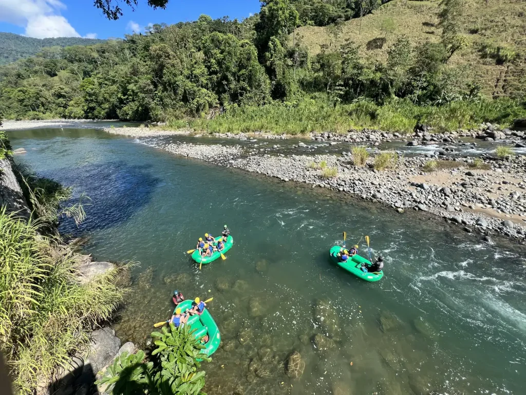 Rafts on the clear green Savegre River from above