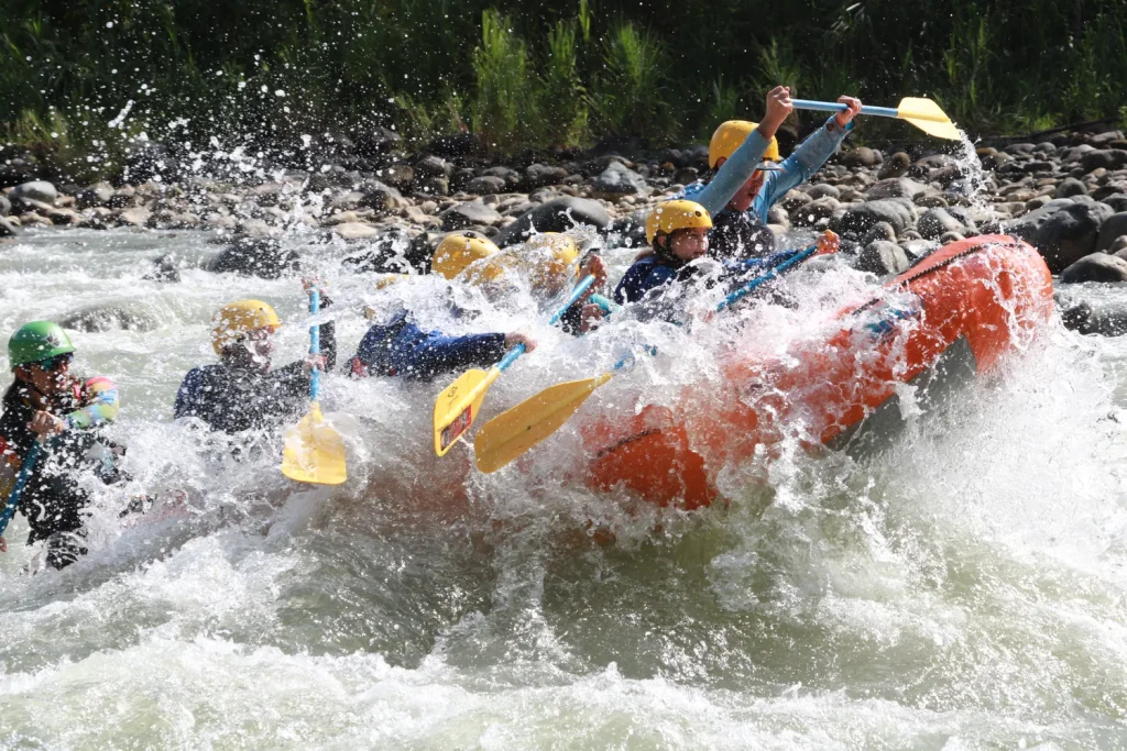 Raft crashing through a rapid on the Savegre River