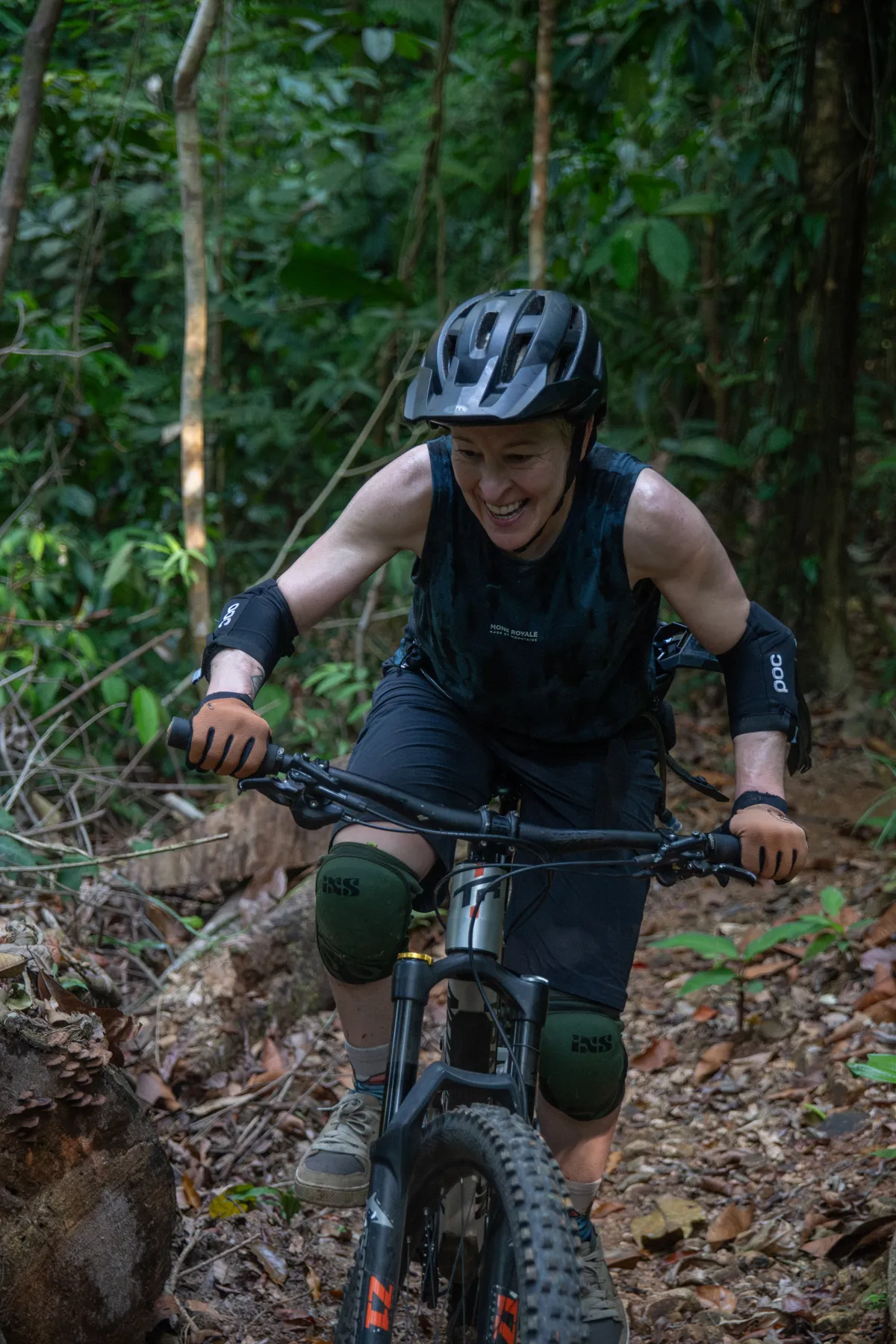 Enduro rider on technical jungle single track at Rafiki