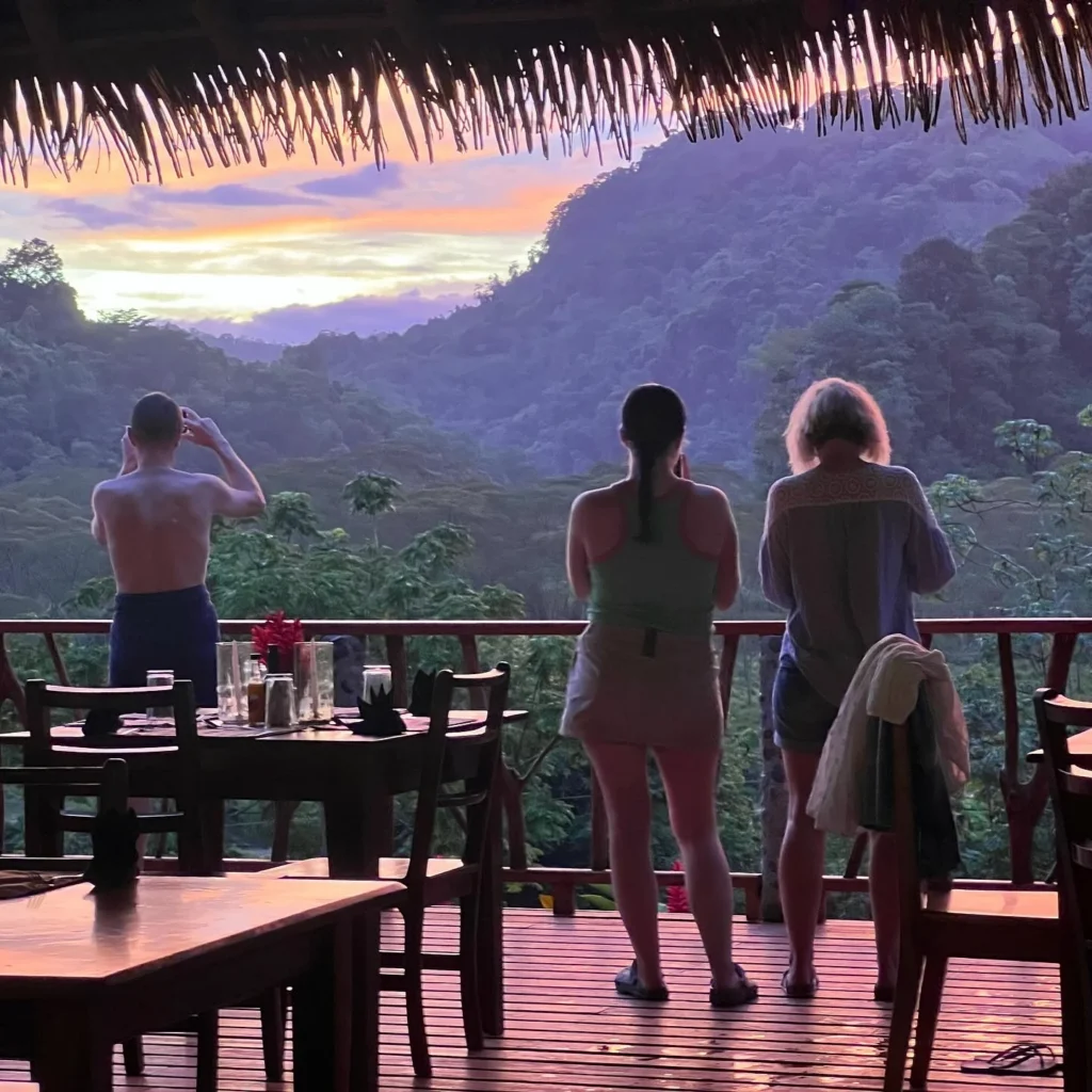 Guests watching the sunset from the deck