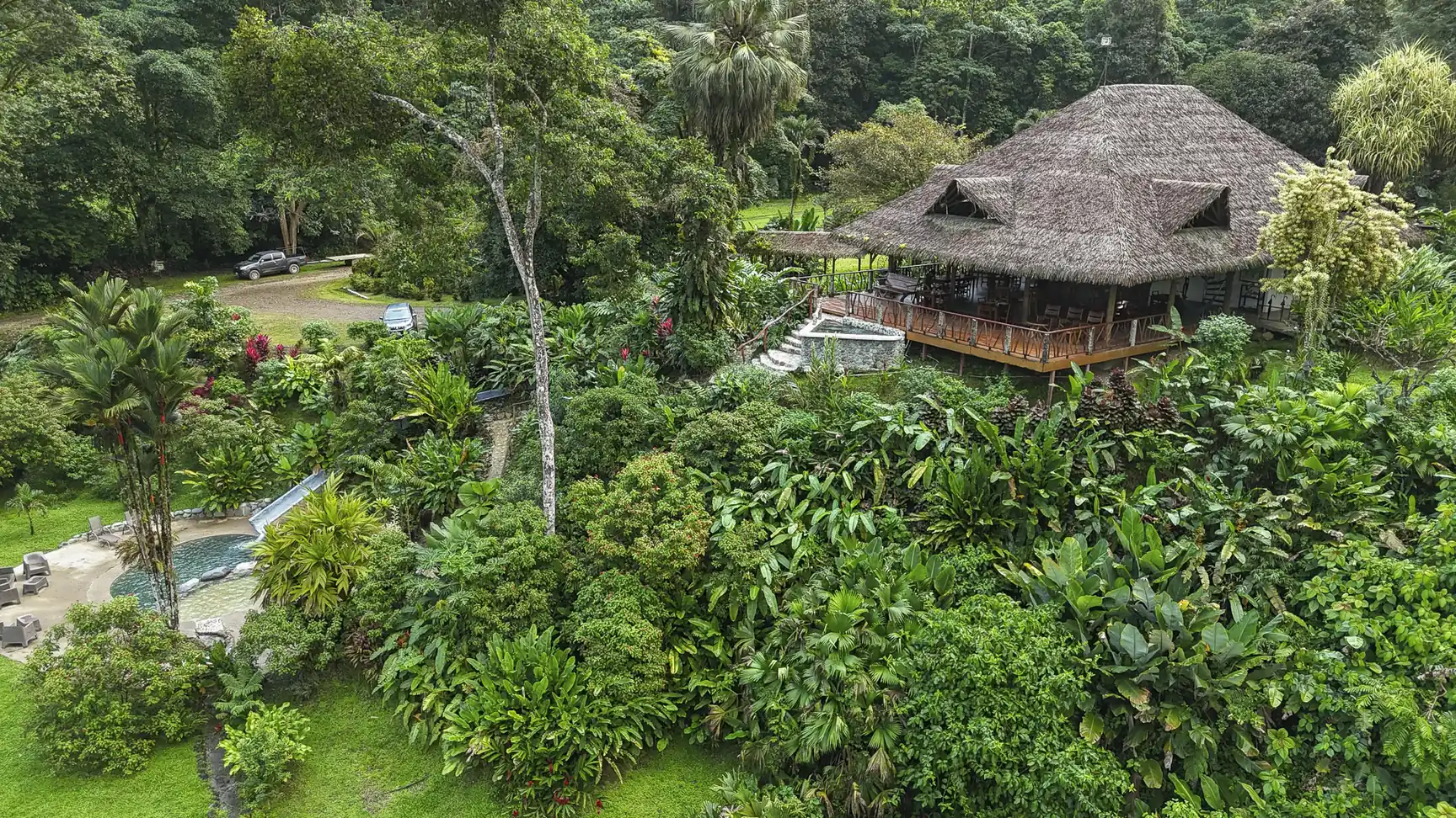 Aerial view of the Main Lodge and pool in the rainforest