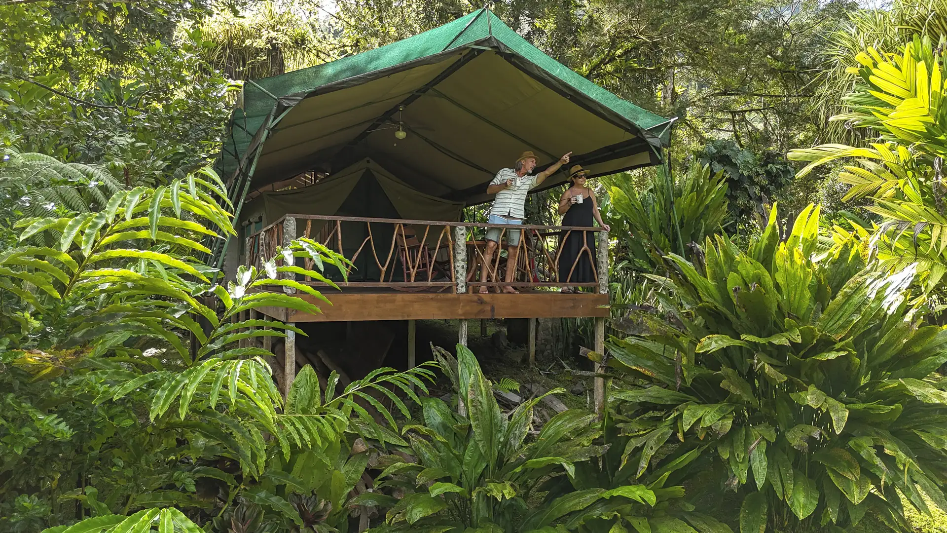 Luxury safari tent deck surrounded by rainforest