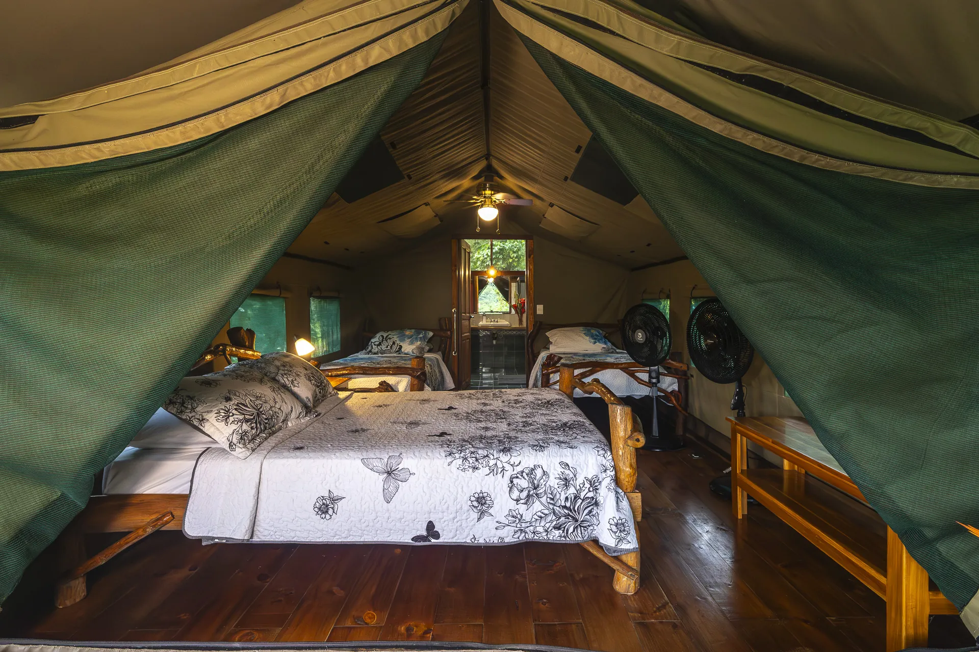 Inside a safari tent at Rafiki — real bed and canvas walls